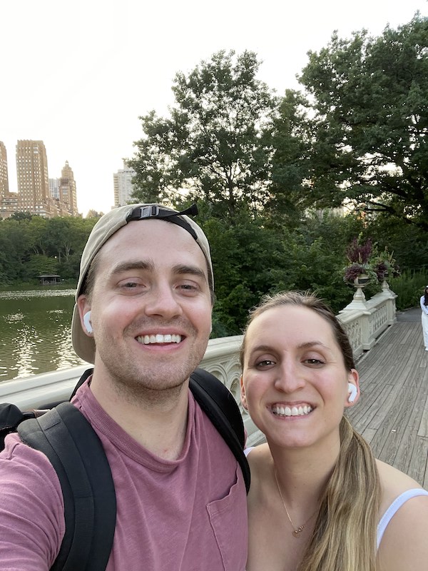 a couple on a date night walking across bow bridge | Better Together Here