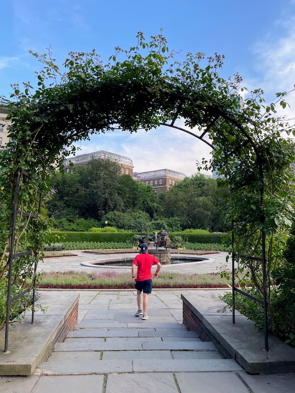 beautiful archway made of roses in the conservatory garden | Better Together Here
