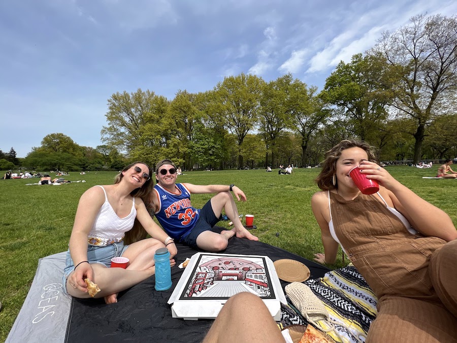 eating pizza for a picnic in sheep meadow in central park | Better Together Here 