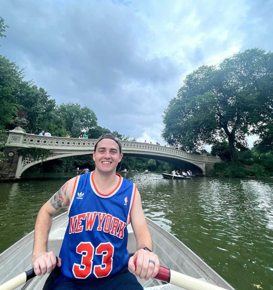 on a row boat in central park near bow bridge lovers bridge | Better Together Here