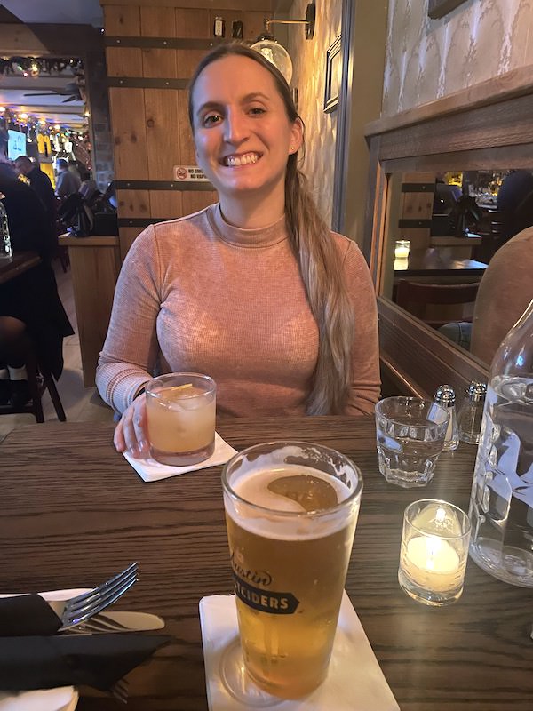 a girl enjoying a cocktail at copper johns NYC | Better Together Here