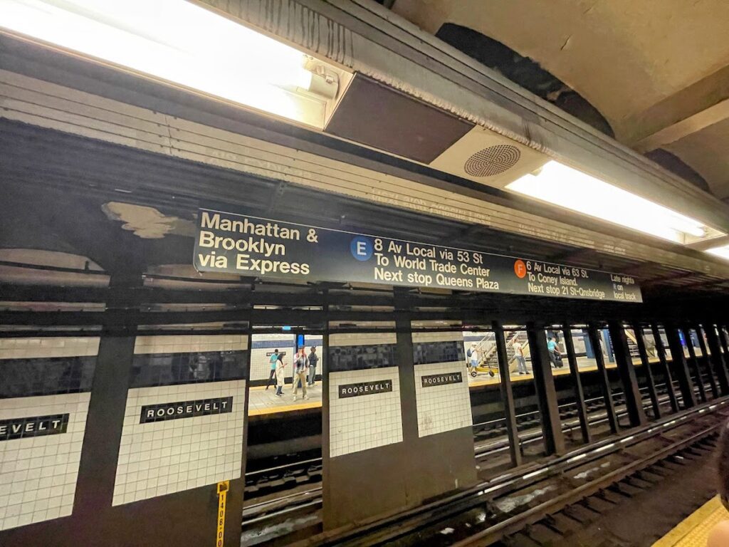 signs for e and f train to manhattan | Better Together Here