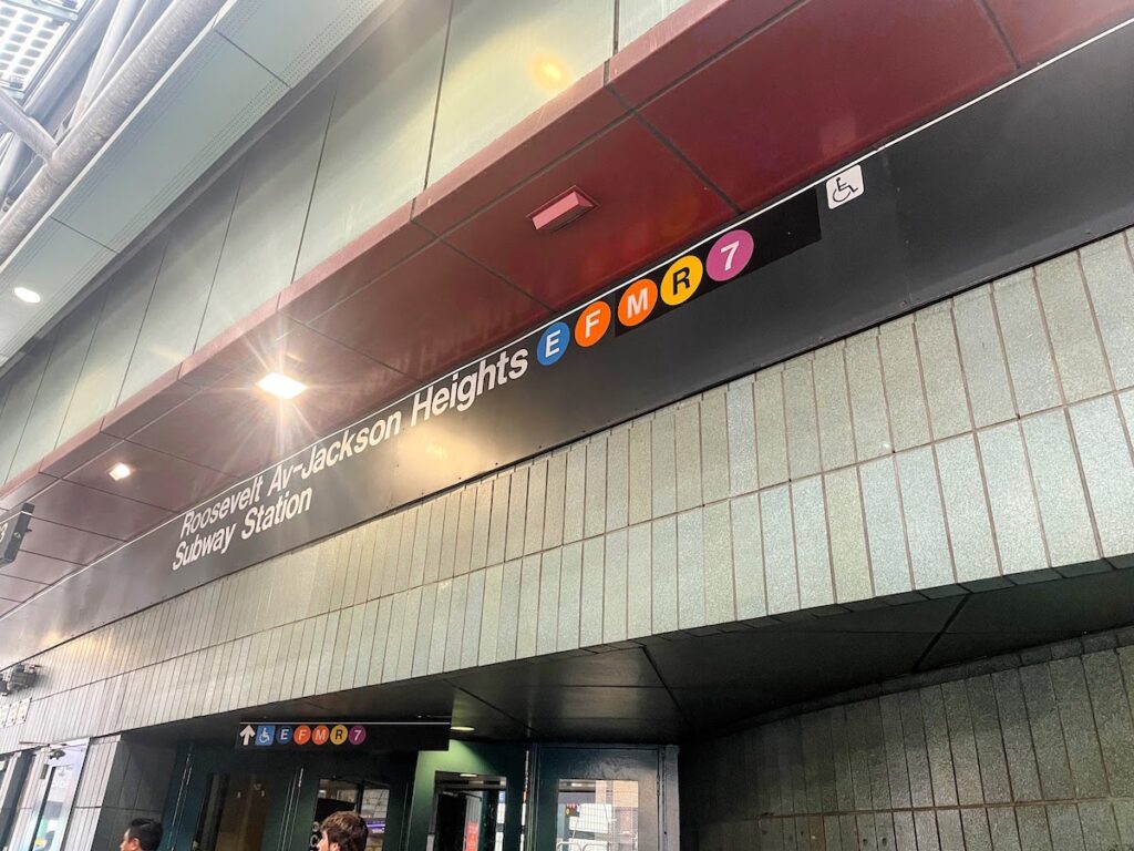 subways signs at jackson heights station | Better Together Here