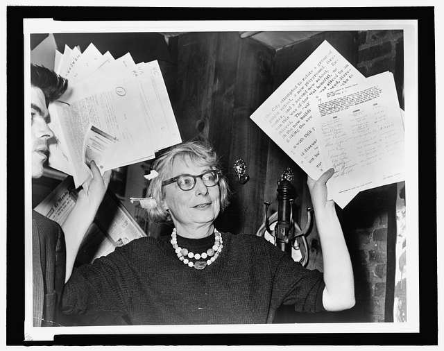 jane jacobs holding up documents | Better Together Here