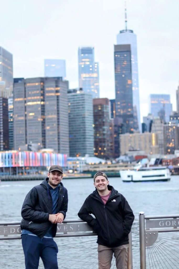 two friends in brooklyn bridge park with view of manhattan in background | Better Together Here