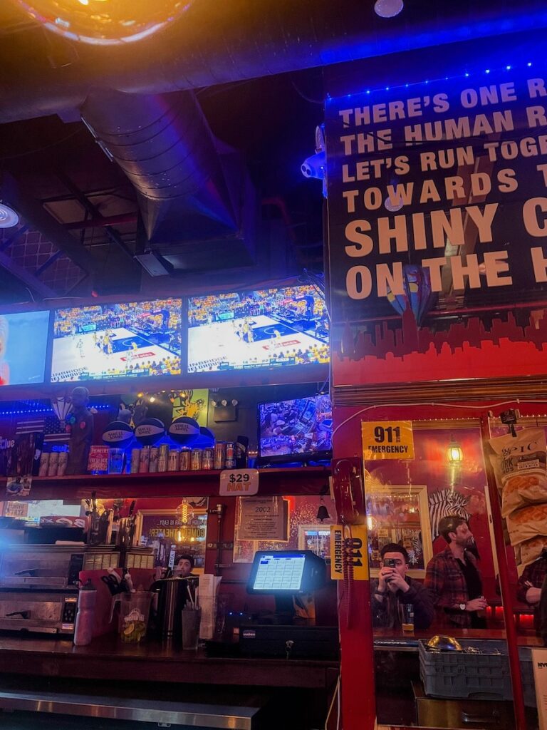 view of bar and seating at pioneers bar in nyc | Better Together Here